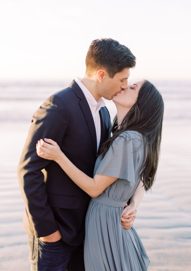 Couple sharing a kiss near Scripps Pier