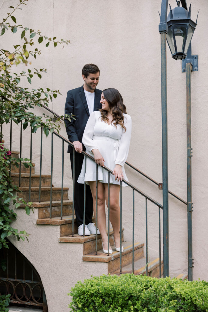 Engaged couple pose together at Balboa Park for engagement photos