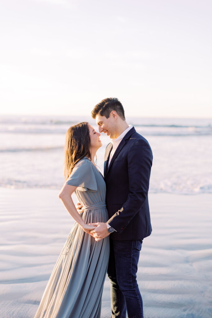 Couple embracing on the sand near Scripps Pier