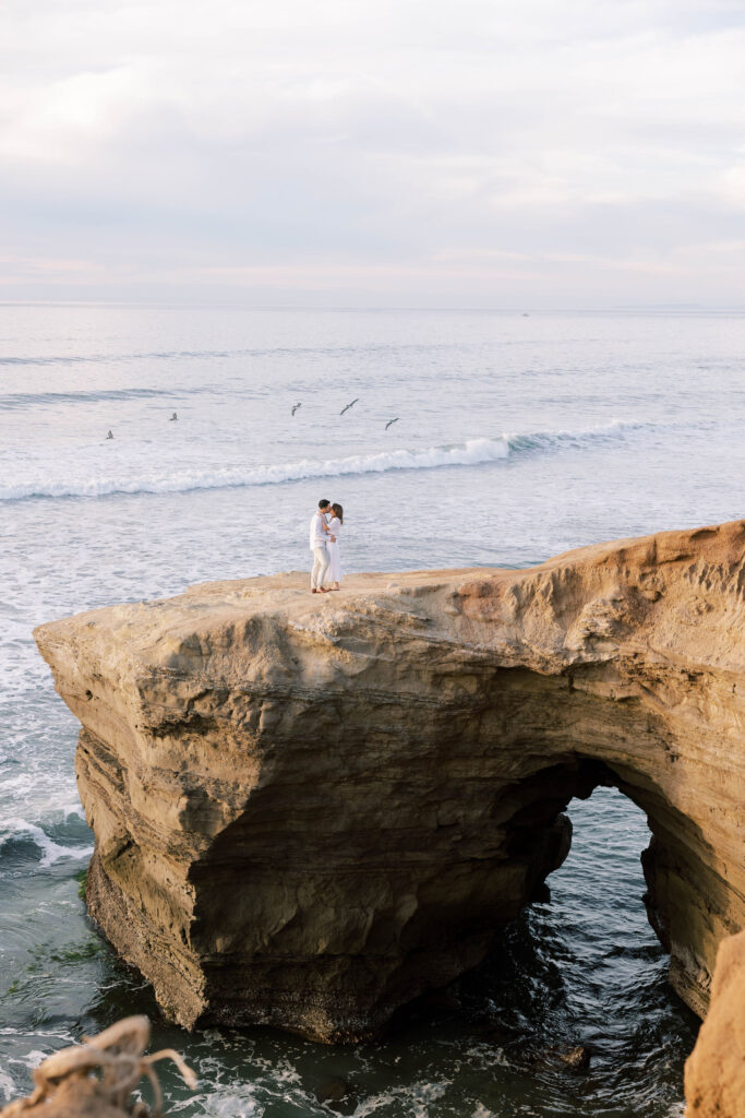 Engaged couple at Sunset Cliffs during blue hour