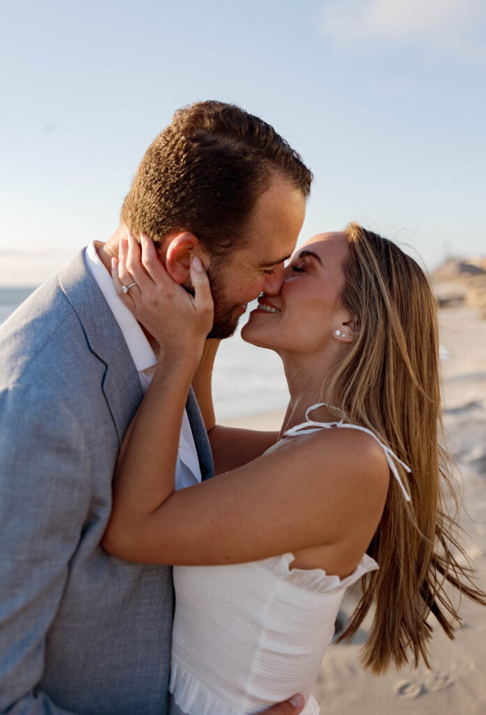 Couple kiss at their Windansea Beach engagement session.