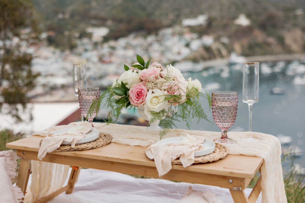 Catalina Island proposal decor with flowers and picnic setup