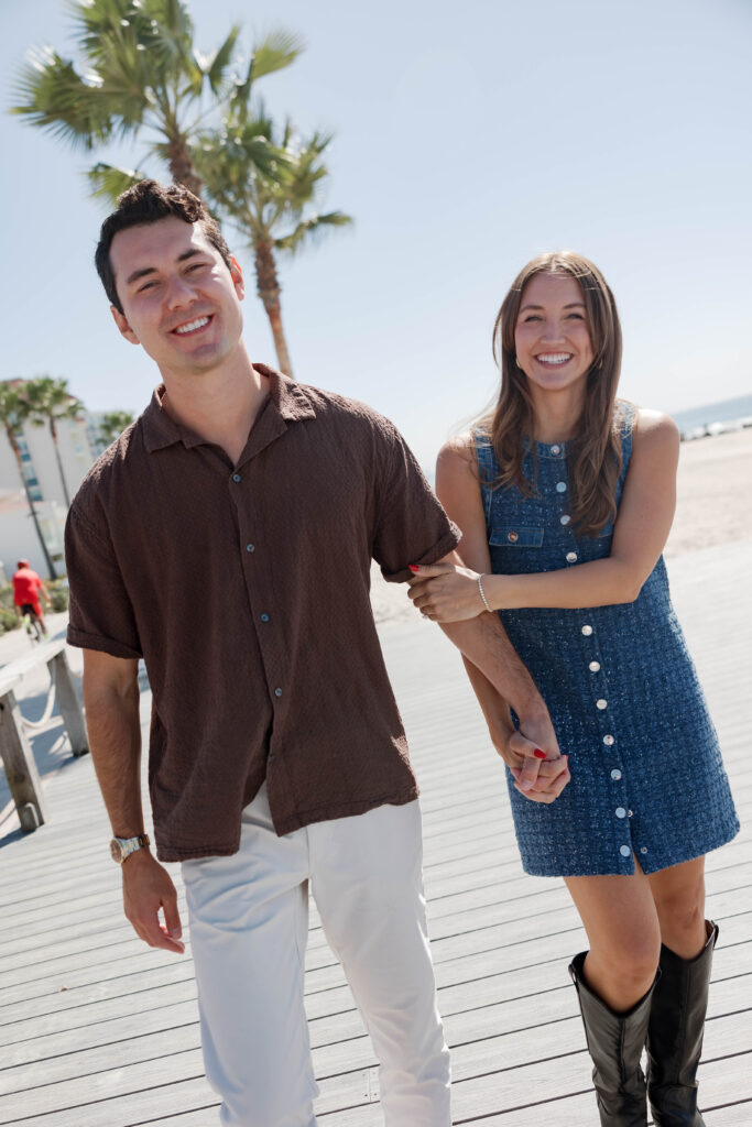 Couple holding hands at Hotel Del Coronado engagement session
