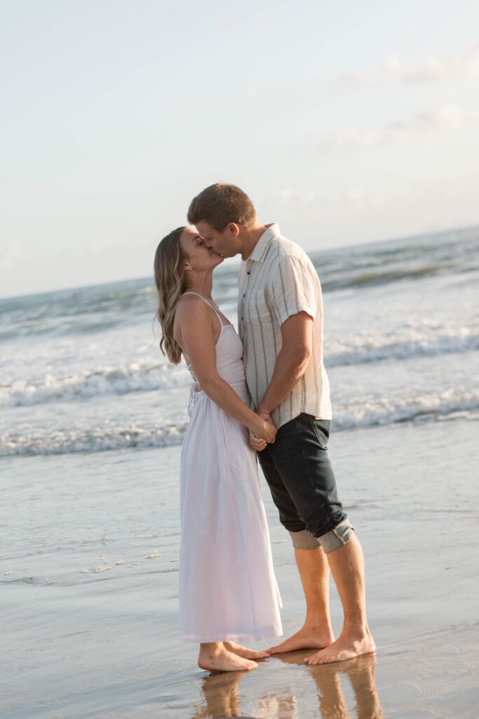 Couple kissing at the beach at Coronado Sand Dunes