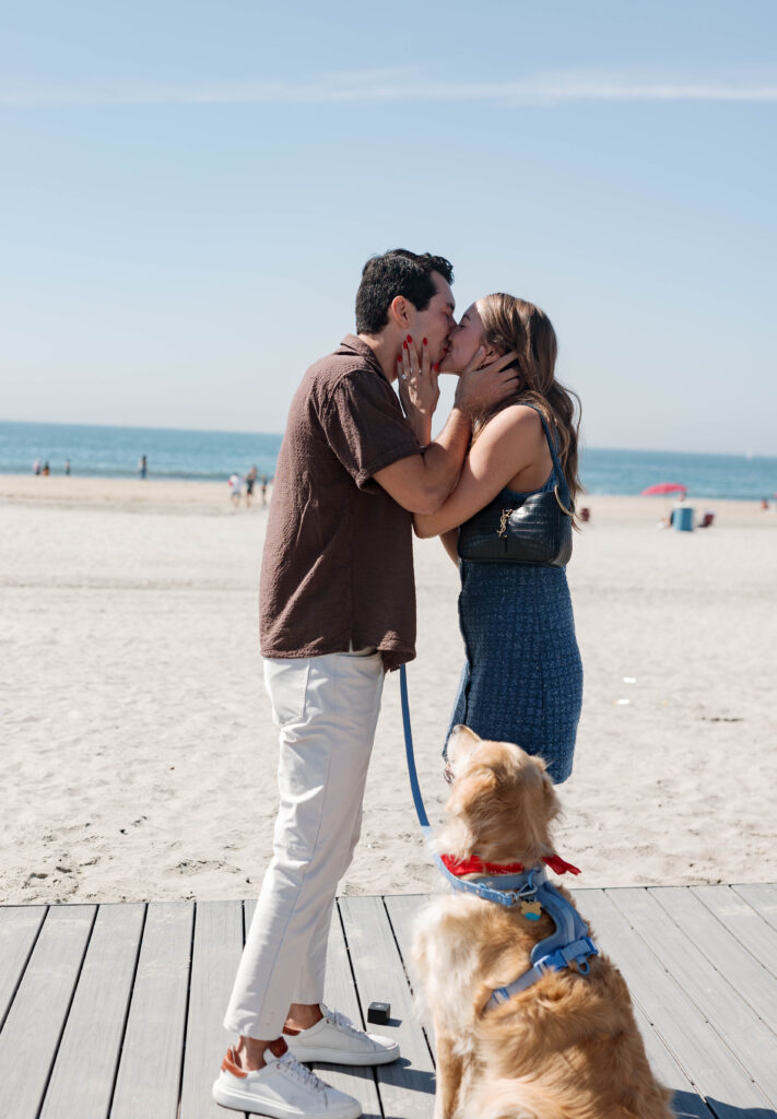 Couple kissing at proposal at Hotel Del Coronado