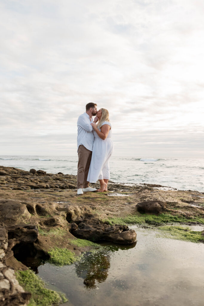 Couple kissing at Sunset Cliffs in San Diego