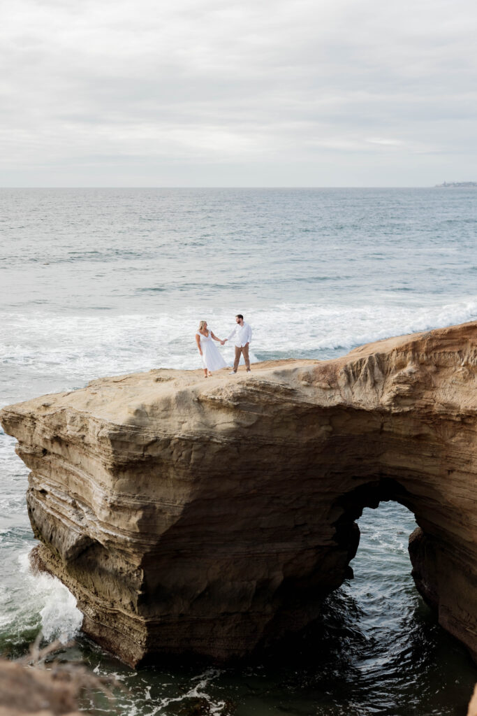 Couple holding hands at Sunset Cliffs