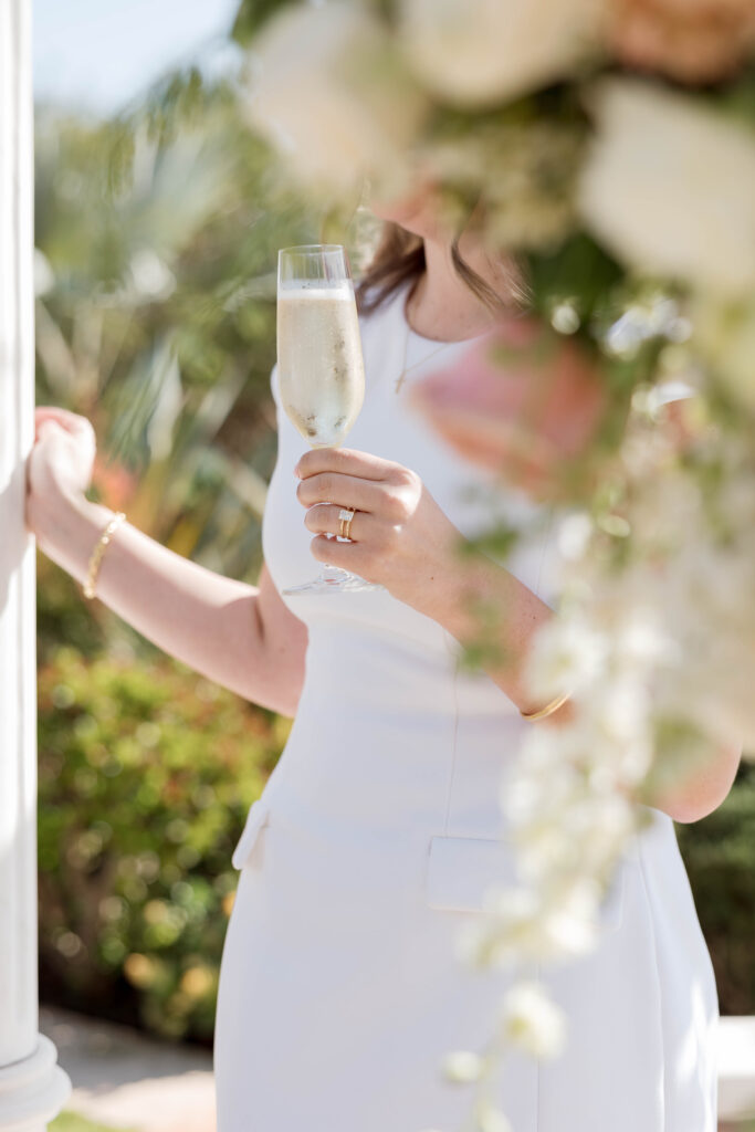 Woman with champagne at Waldorf Astoria Garden in San Diego