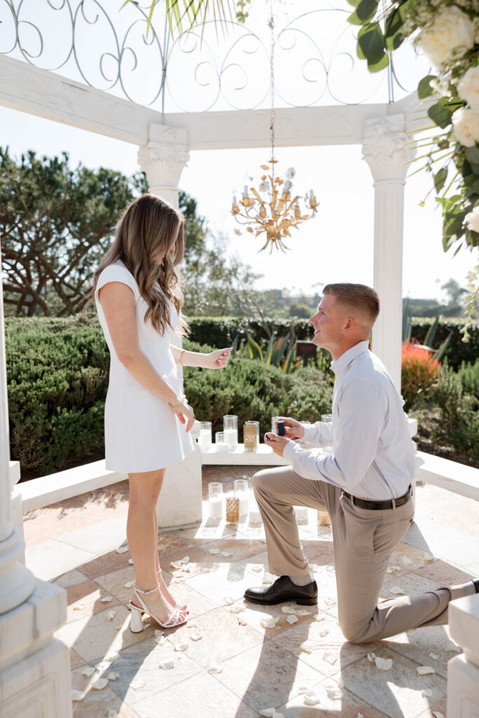Man proposing at Waldorf Astoria Garden under gazebo