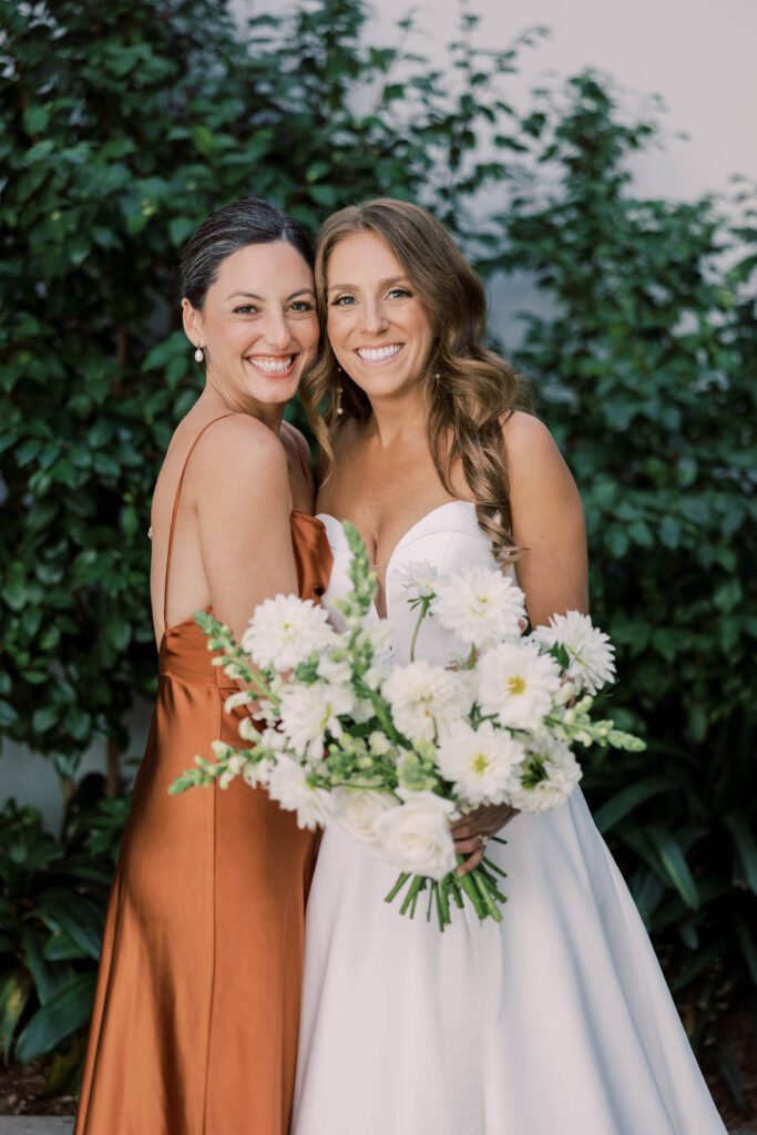 Bride with bridesmaid at Park Hyatt Aviara in San Diego