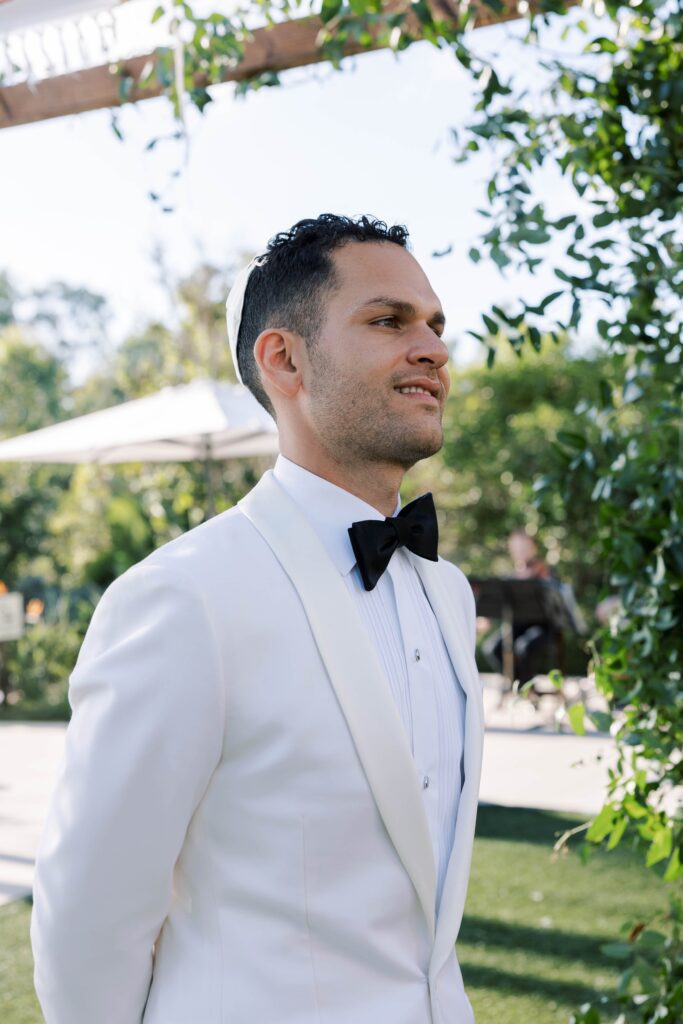 Groom at wedding ceremony at Park Hyatt Aviara