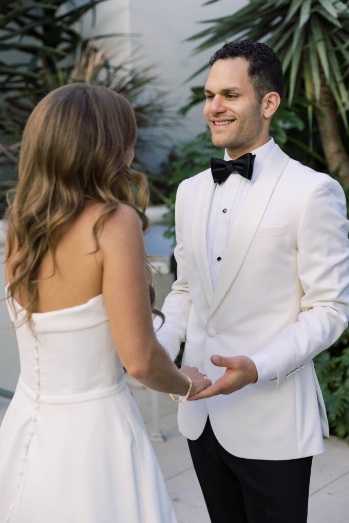 Bride and groom holding hands at Park Hyatt Aviara