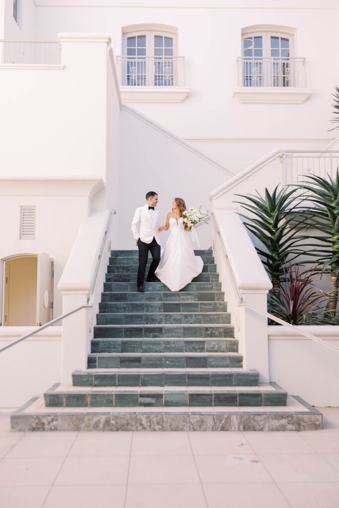 Bride and groom walking down stairs at Park Hyatt Aviara