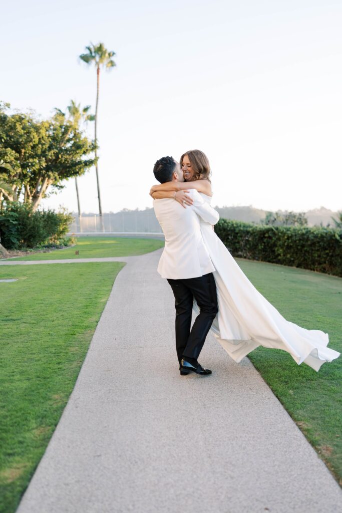 Bride and groom embrace at Park Hyatt Aviara in San Diego