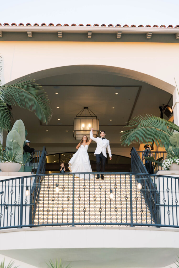 Bride and groom enter wedding reception at Park Hyatt Aviara