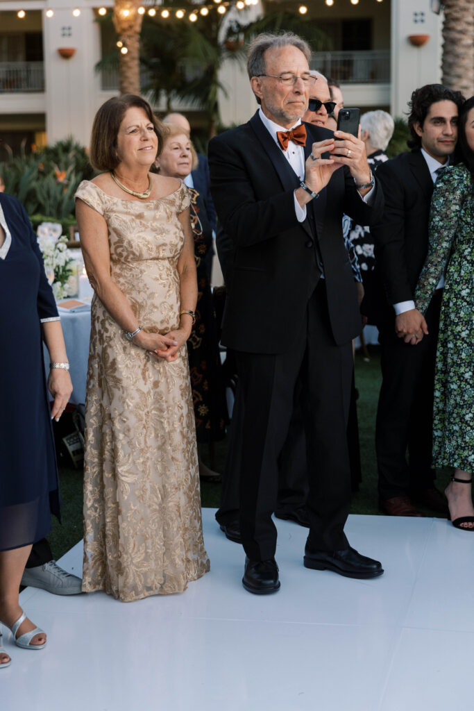 Guests watch the couple at Park Hyatt Aviara wedding reception