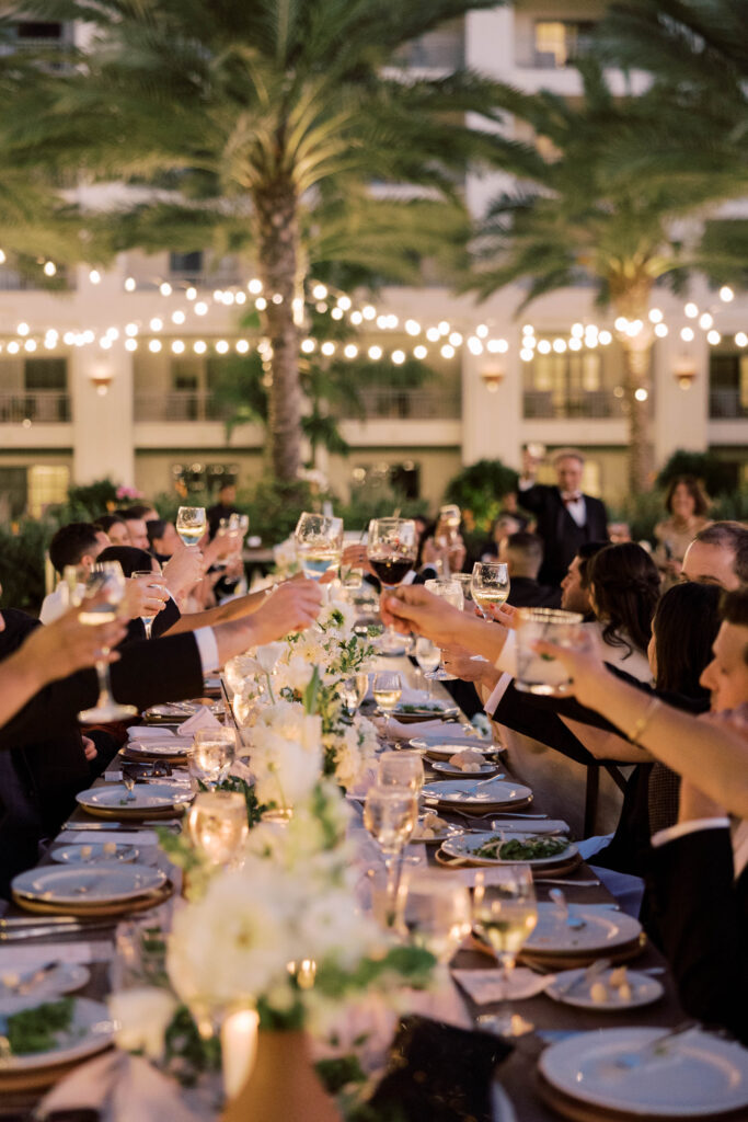 Guests doing a toast at Park Hyatt Aviara wedding reception