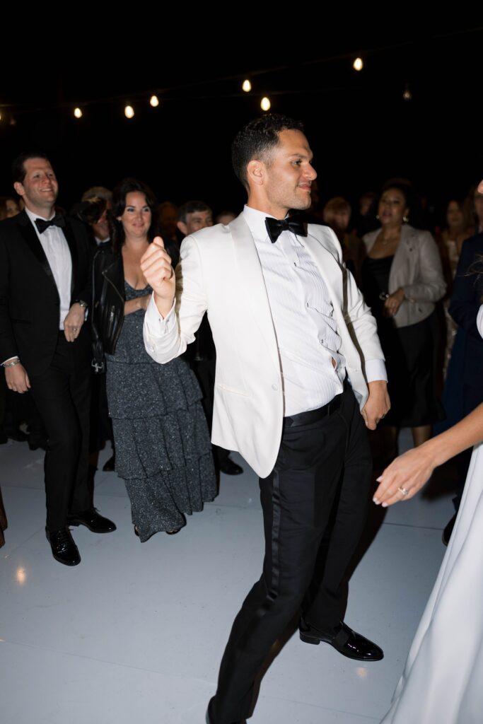 Groom dancing at Park Hyatt Aviara wedding reception in San Diego