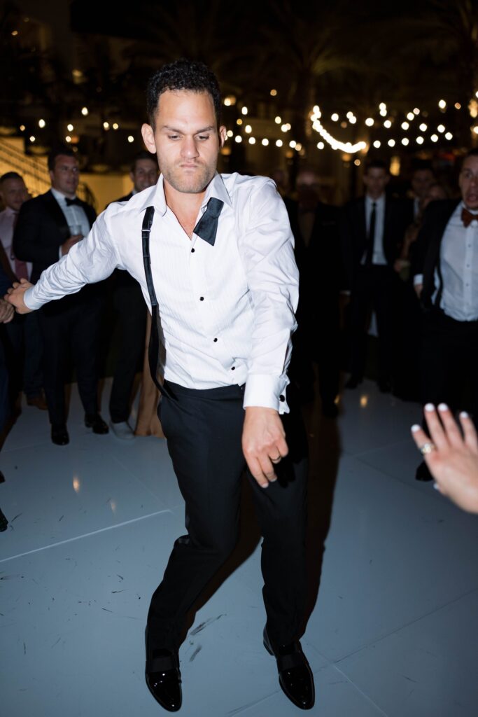 Groom dancing at Park Hyatt Aviara wedding reception in San Diego