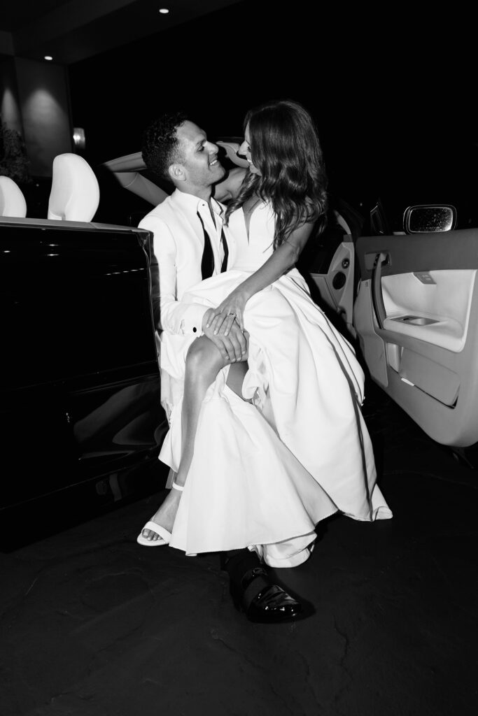 Bride and groom in car at Park Hyatt Aviara wedding reception