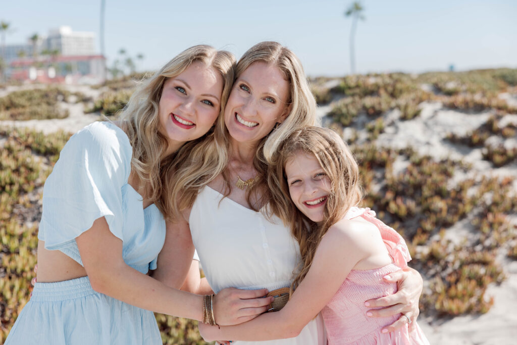 Family hugging each other at Coronado