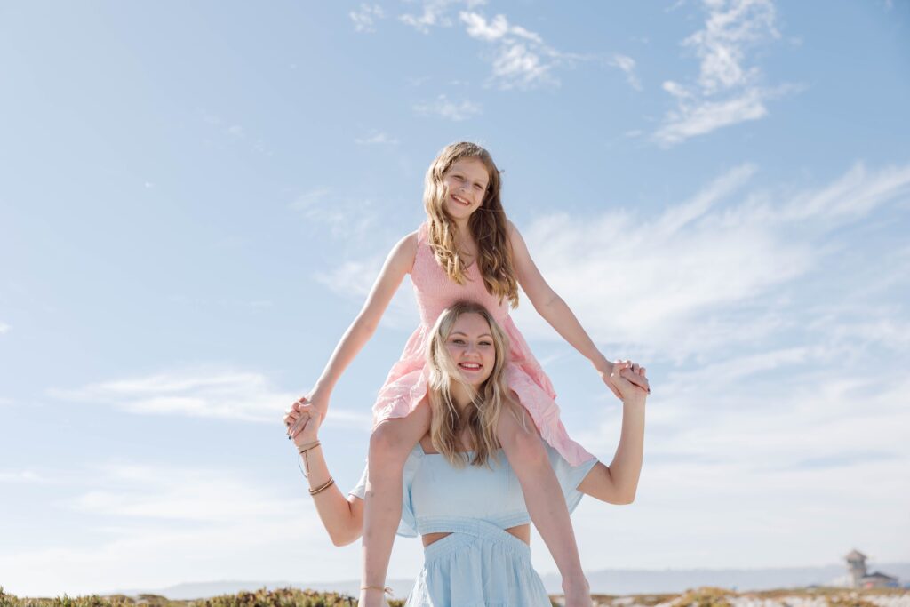 Girls holding hands at Coronado Sand Dunes