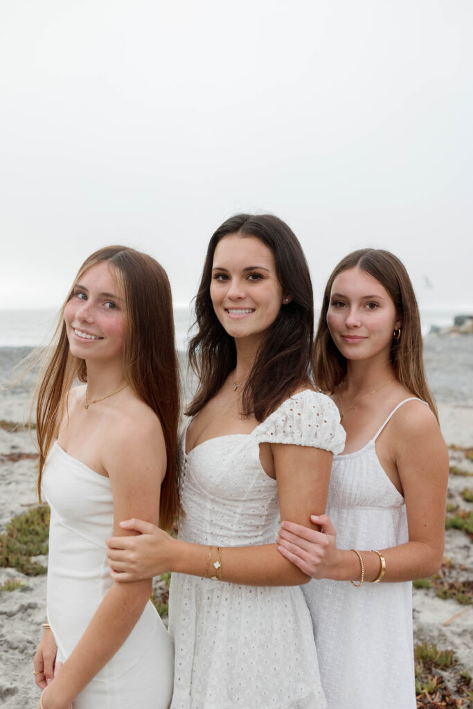 Daughters pose together at Army Navy Beach