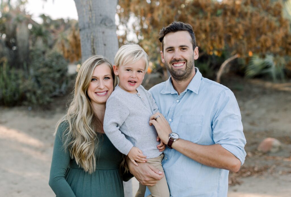 Parents holding child at Balboa Park Desert Gardens