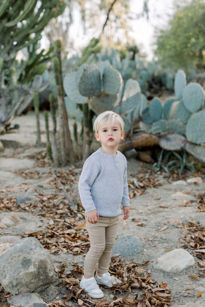 Child looks at camera at Balboa Park Desert Gardens