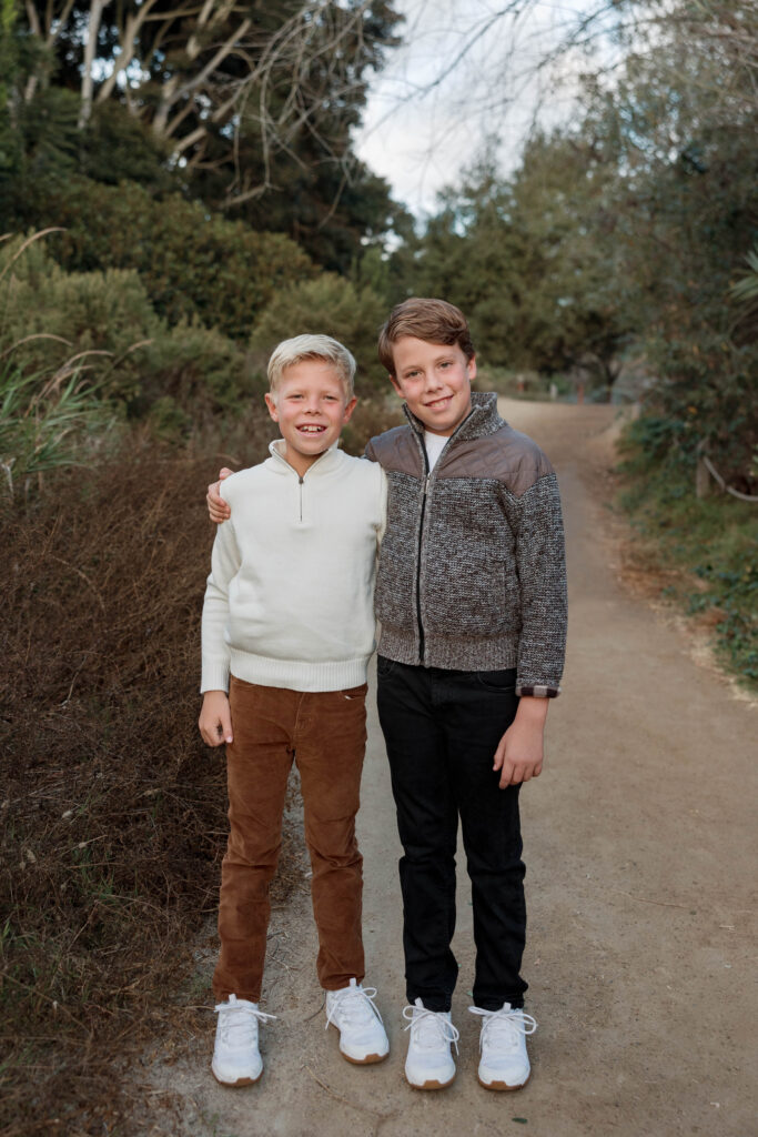 Boys smile at camera at Batiquitos Lagoon