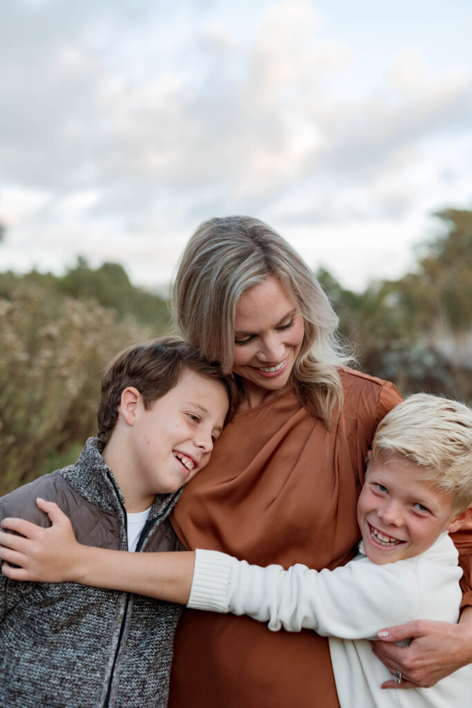 Mom and her boys hug