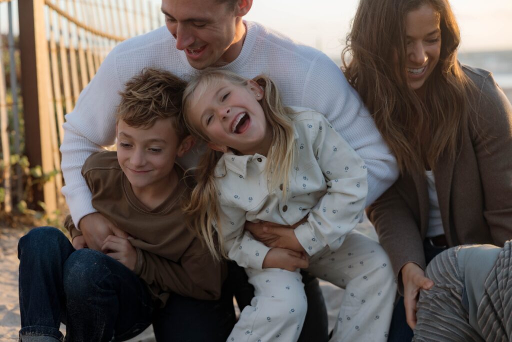 Family laughs together at Cardiff State Beach