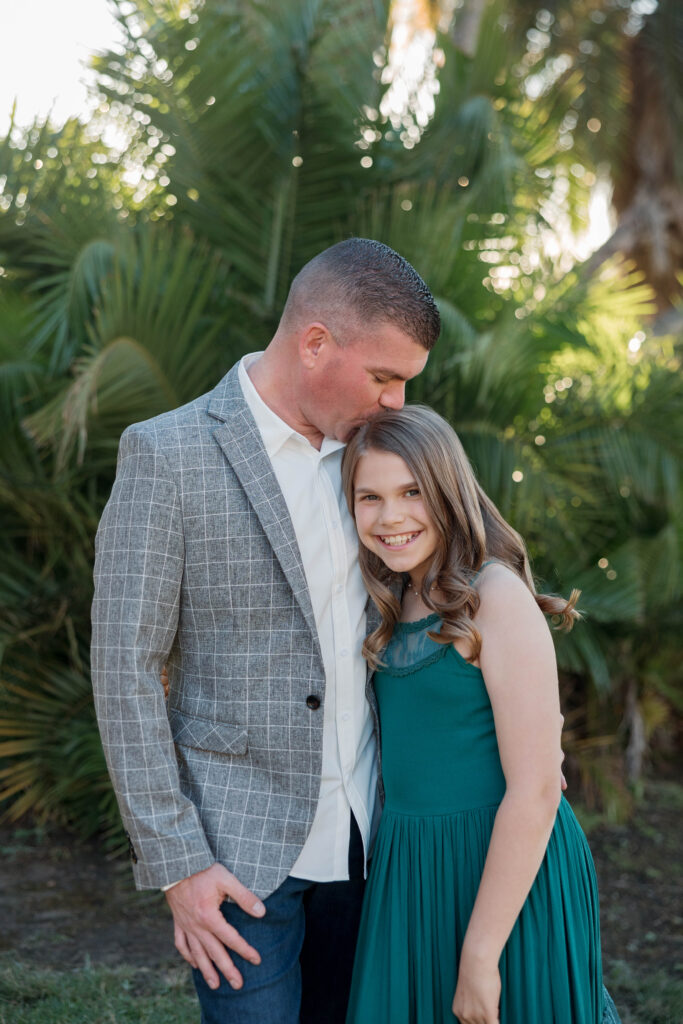 Dad kisses daughter in photoshoot at Presidio Park