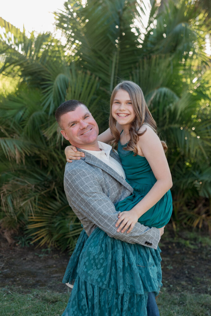 Dad holds daughter in photoshoot at Presidio Park