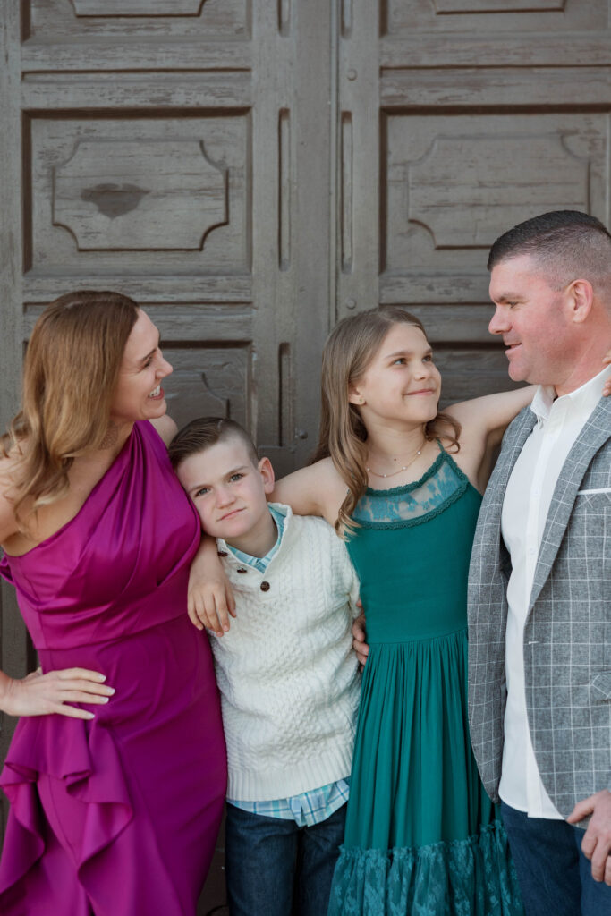 Family smiles and laughs together at Presidio Park photoshoot