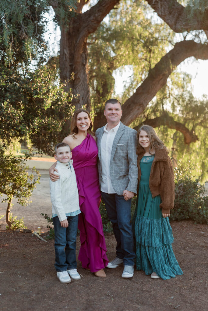 Family smiles at the camera at Presidio Park