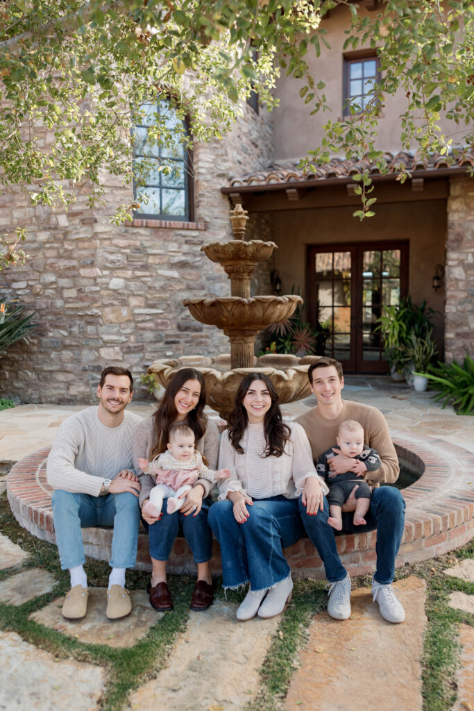 Family smiles at the camera in San Diego family photoshoot