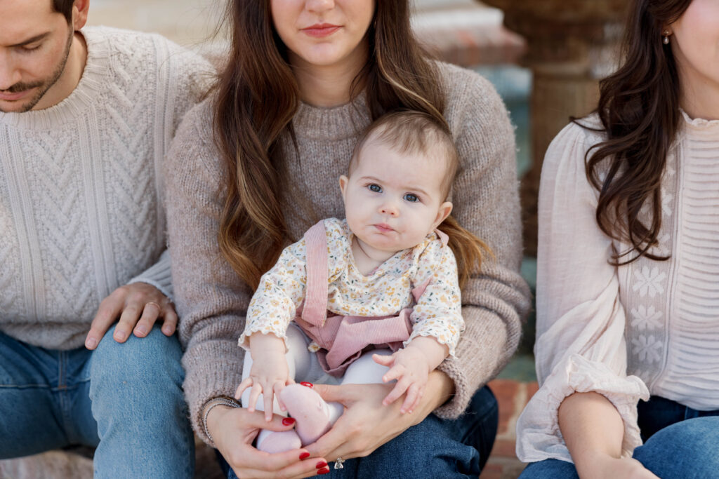 Family holds baby at photoshoot in San Diego