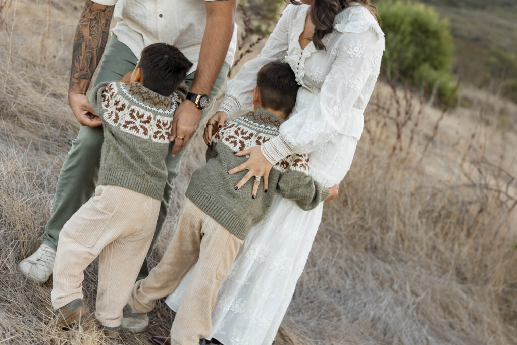 Kids hugging parents at San Elijo