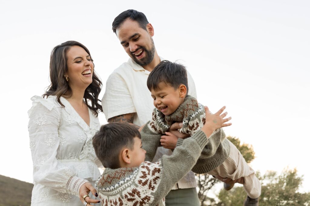 Family laughing together at San Elijo
